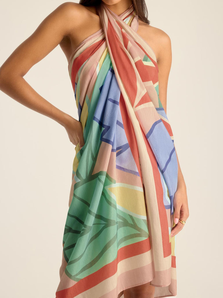Woman wearing a jungle printed swim cover up