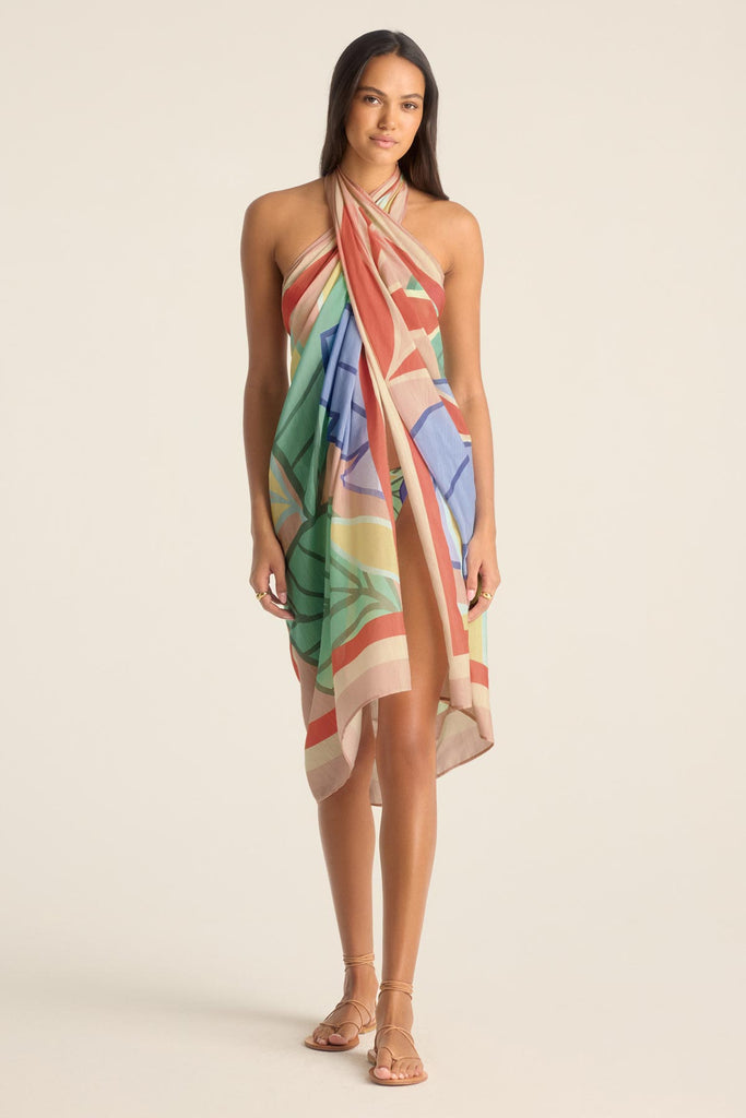 Woman wearing a jungle printed swim cover up