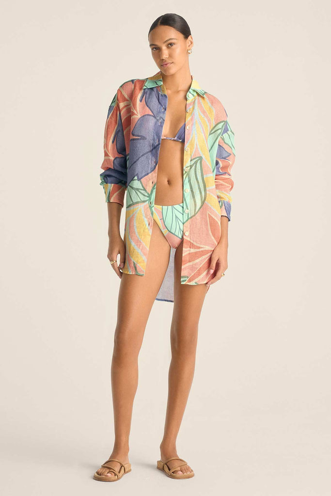 Woman wearing a jungle printed long sleeve beach shirt