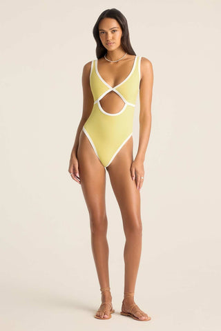 Woman wearing a yellow one-piece swimsuit with white trim